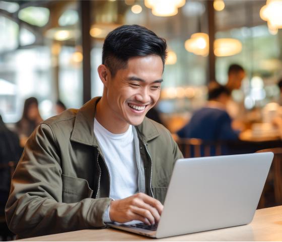 Person using laptop in public